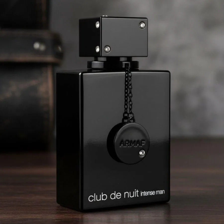 Black Club de Nuit Intense Man bottle on a wooden table